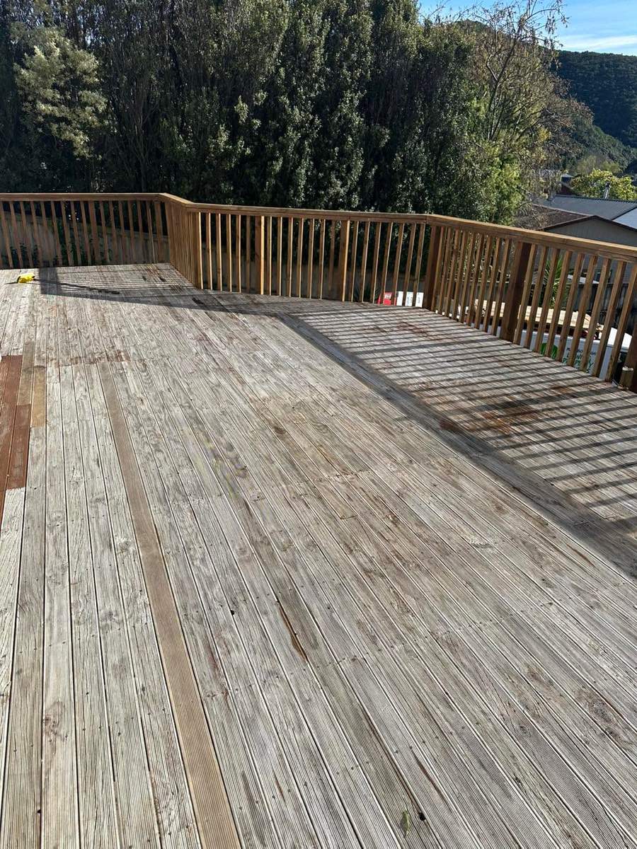 Deck before water blasting, weathered grey timber
