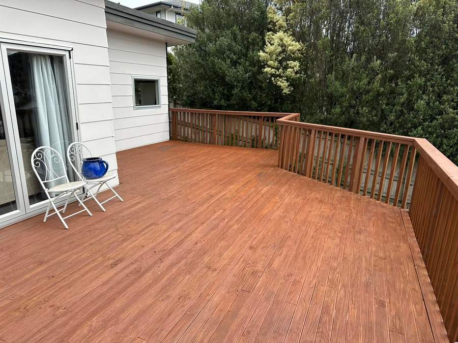 Restained deck with hillside view