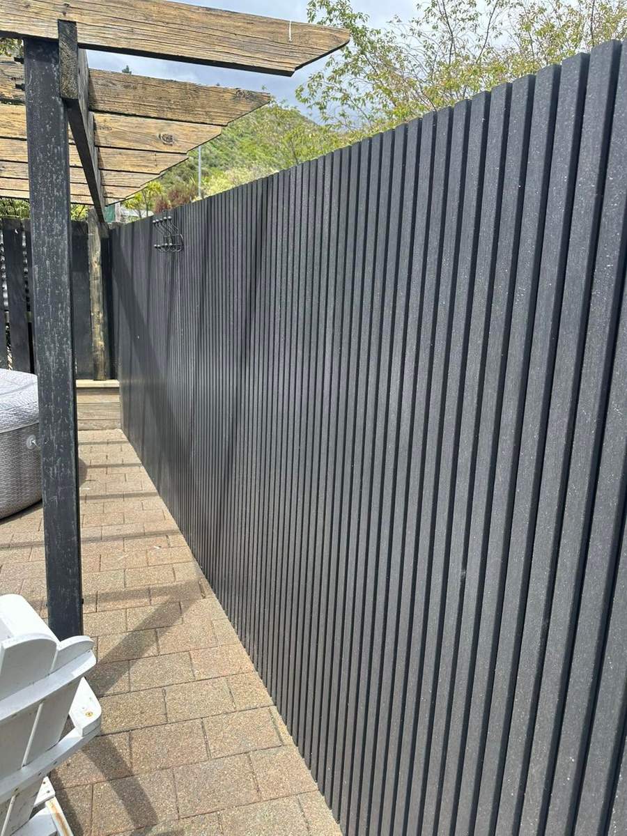 Full composite fence wall installed