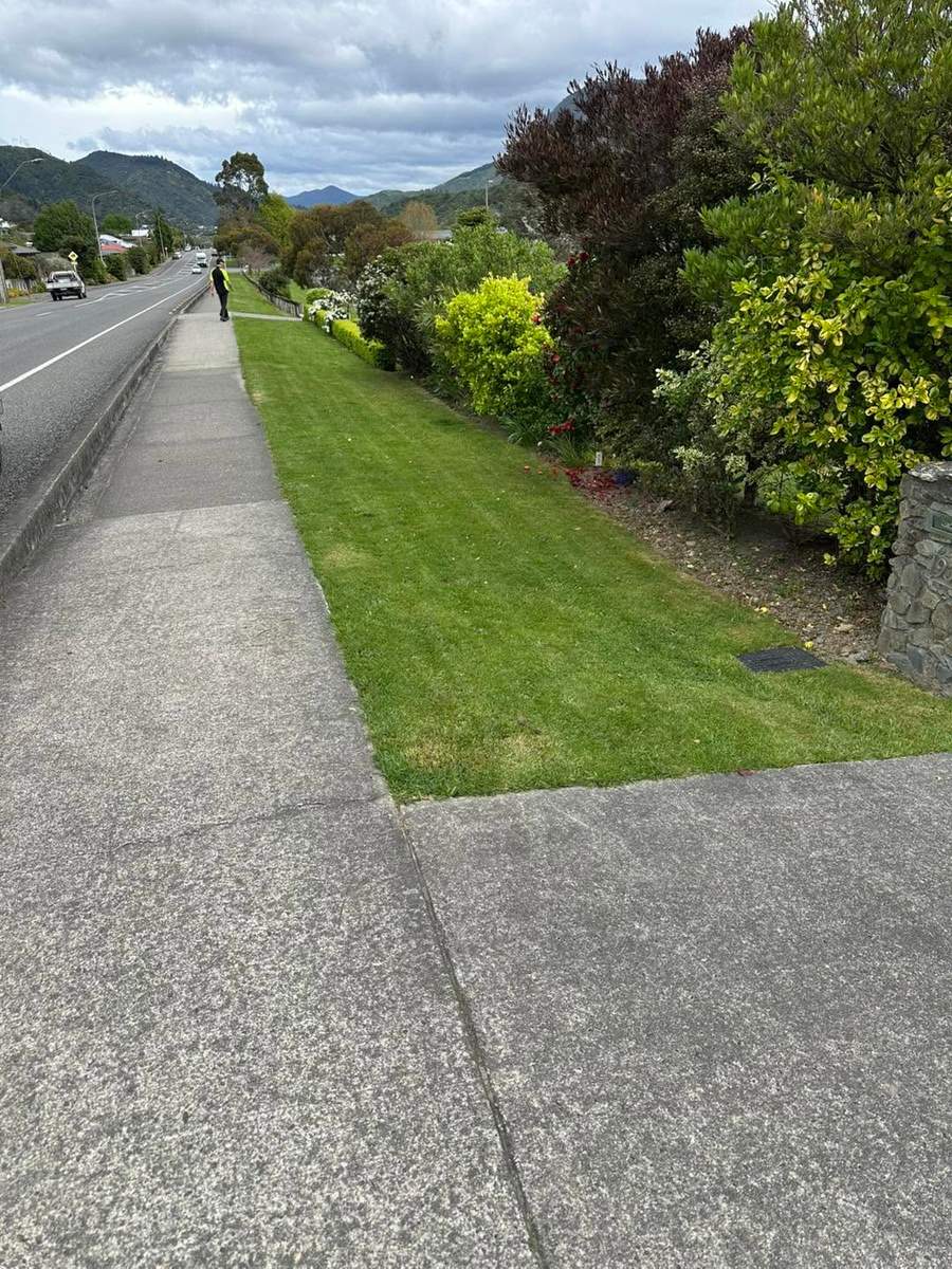 Freshly mowed grass verge alongside a road