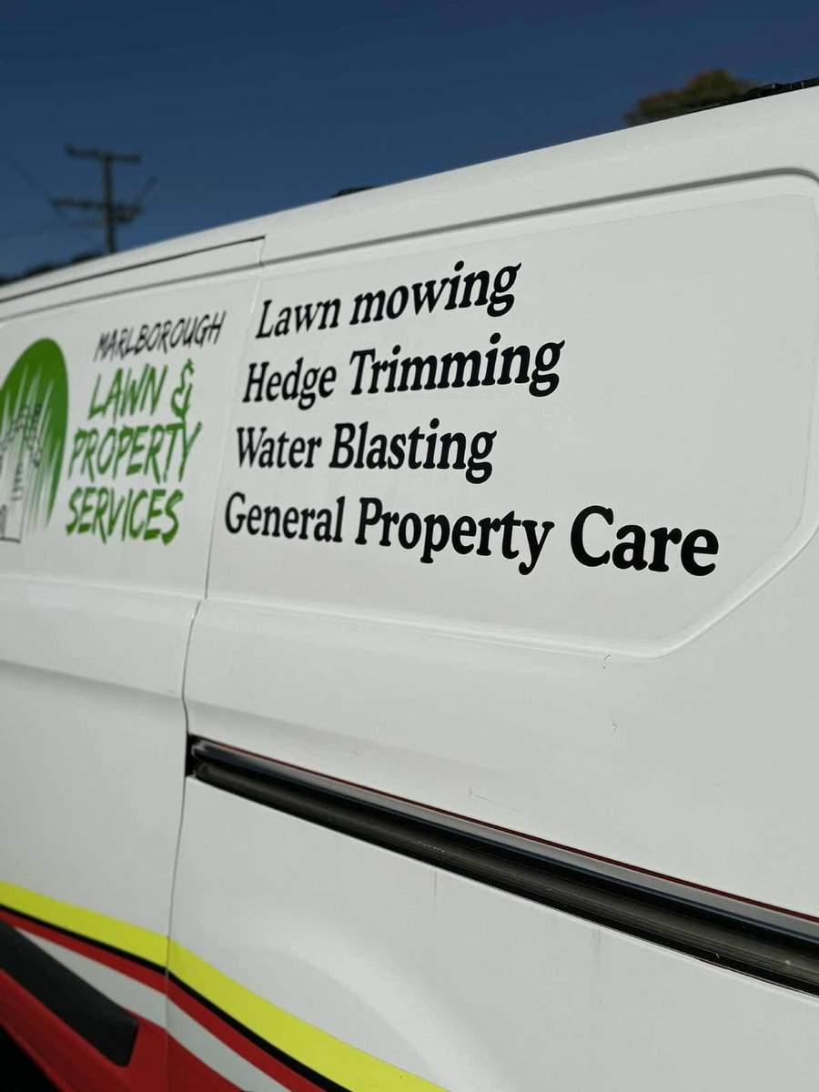 Close-up of the van's Marlborough Lawns & Property Services signage